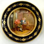 A FRENCH PORCELAIN CABINET PLATE, PAINTED IN THE MANNER OF TENIERS WITH A PEASANT COUPLE IN AN