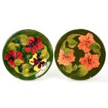 TWO MOORCROFT HIBISCUS PLATES, DESIGNED BY WALTER MOORCROFT, C1970, 31CM D, IMPRESSED MARKS, BLUE OR