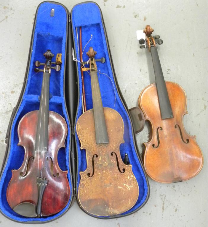 THREE VARIOUS VIOLINS AND A BOW