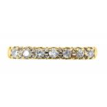 A SEVEN STONE DIAMOND RING IN 18CT GOLD, SHEFFIELD 1994, MARKED 0.20, 2.35G, SIZE O 1/2++GOOD