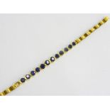 A SAPPHIRE BRACELET IN GOLD, UNMARKED, 190 MM L, 7.7G ++ONE STONE MISSING