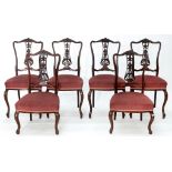 A SET OF SIX EDWARDIAN CARVED MAHOGANY SALON CHAIRS