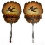 A PAIR OF VICTORIAN PAPIER MACHE FACE SCREENS, PAINTED WITH A SWALLOW AND GILT, EBONISED HANDLE,