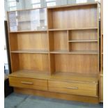 A 1970'S TEAK WALL UNIT, 178CM H X 180CM W AND A 1970'S KITCHEN TABLE AND CHAIRS, WITH LAMINATE TOP,