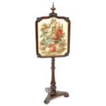 A VICTORIAN ROSEWOOD POLE SCREEN, THE NEEDLEWORK BANNER FEATURING A PARROT AND FLOWERS, 155CM H