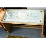 A CHINESE STYLE CARVED HARDWOOD COFFEE TABLE, THE TOP DECORATED WITH A NEEDLEWORK SILK PANEL, 55CM