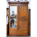 A VICTORIAN WALNUT COMPACTUM WARDROBE WITH MIRRORED DOOR, FITTED WITH ONE LONG AND THREE SHORT