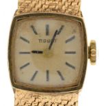 A TISSOT 9CT GOLD LADY'S WRISTWATCH, 15 X 15 MM, 43G++WATCH RUNNING; SCRATCHES TO GLASS, SPOTS AND