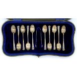 A SET OF TEN EDWARD VII SILVER SPIRAL STEM COFFEE SPOONS AND PAIR OF SUGAR BOWS, SHEFFIELD 1905,