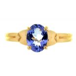 A TANZANITE RING IN 18CT GOLD, THE OVAL TANZANITE APPROX 7 X 5.5 MM, 4G, SIZE N++GOOD CONDITION