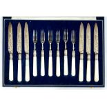 A SET OF SIX VICTORIAN MOTHER OF PEARL HAFTED SILVER DESSERT KNIVES AND FORKS, ENGRAVED WITH