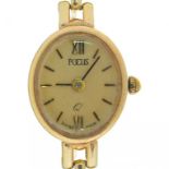 A FOCUS 9CT GOLD LADY'S WRISTWATCH, 17 X 15 MM, 12.3G++WEAR TO DIAL; WATCH NOT RUNNING