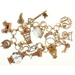 A GOLD CHARM BRACELET, THREE CHARMS UNMARKED, BRACELET MARKED 9CT, 20CM, 41G++GOOD CONDITION