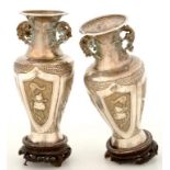 A PAIR OF SOUTH EAST ASIAN PARCEL-GILT REPOUSSÉ VASES OF SHOULDERED FORM, WITH PRUNUS HANDLES,