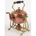 AN EDWARDIAN ART NOUVEAU COPPER AND BRASS SPIRIT KETTLE ON LAMP STAND WITH TURNED EBONISED HANDLE,