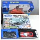 SCALEXTRIX SET, MGA ROADSTER, RADIO CONTROLLED LIFEBOAT MODEL AND A MODEL FERRARI, ALL BOXED