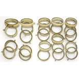 A SET OF 24 VICTORIAN GILTMETAL CURTAIN RINGS, 10CM DIAM, CREAM PAINTED