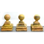 A SET OF THREE LATE VICTORIAN OR EDWARDIAN TERRACOTTA GATE OR SIMILAR PIER FINIALS ON SQUARE BASE,