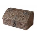 A NORTHERN EUROPEAN CHIP CARVED OAK CASKET, 17TH C of boarded construction, the front, top and