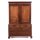 A GEORGE III MAHOGANY LINEN PRESS, C1780 adapted as a wardrobe with plain figured panels and shell