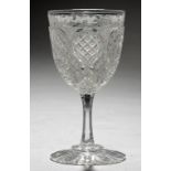 AN ENGLISH ARMORIAL WINE GLASS, C1900 the finely cut bowl engraved with crest and motto of Launce