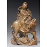 A CHINESE CARVED SOAPSTONE FIGURE OF AN IMMORTAL RIDING ON A DEER, C LATE 19TH C 19cm h++Accretion