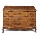 A SOUTH GERMAN SERPENTINE WALNUT COMMODE, MID 18TH C the quarter veneered top, sides and drawers