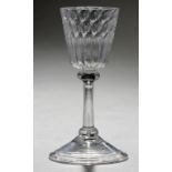 A NORTHERN EUROPEAN WINE GLASS, LIEGE, C1760 the honeycomb moulded, round funnel bowl with basal