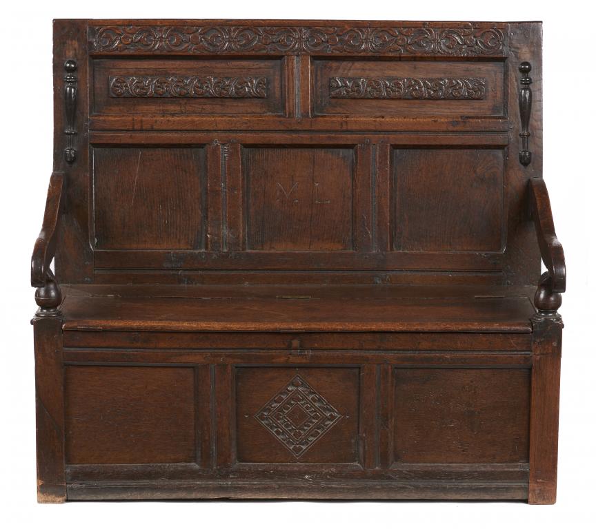 A WILLIAM III OAK SETTLE, C1700 a panel to the back incised with initials ML and applied with