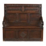 A WILLIAM III OAK SETTLE, C1700 a panel to the back incised with initials ML and applied with
