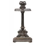 A VICTORIAN CAST IRON UMBRELLA STAND, C1880 of columnar design with grotesques, tray, 70cm h; 17 x