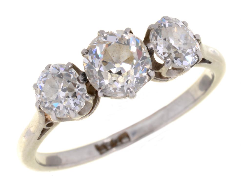 A DIAMOND THREE STONE RING with old cut diamonds, in platinum, marked PLAT, 3.3g, size L++Tiny