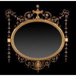 A VICTORIAN NEO CLASSICAL REVIVAL GILTWOOD AND COMPOSITION MIRROR, LATE 19TH C with bevelled