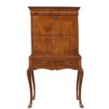A WILLIAM III WALNUT AND FEATHERBANDED SCRIPTOR, C1690 on later stand with a drawer with stepped