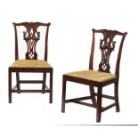 A PAIR OF GEORGE III CARVED MAHOGANY DINING CHAIRS, C1780 with interlaced gothic splat and stuffed