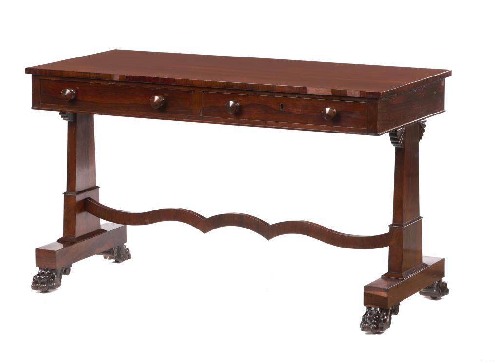 A VICTORIAN ROSEWOOD WRITING TABLE the rectangular top fitted with two drawers, on trestles with