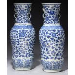 A PAIR OF CHINESE BLUE AND WHITE DOUBLE BALUSTER VASES, QING DYNASTY, 18TH/19TH C the flared neck