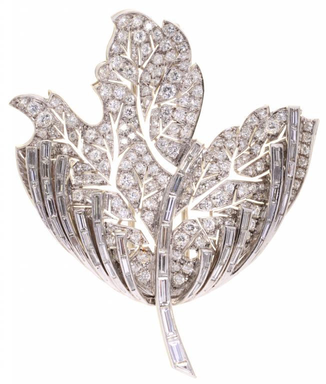 RENE KERN. A DIAMOND BROOCH, C1960 designed as a flower with round brilliant and baguette cut