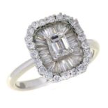 A DIAMOND CLUSTER RING with larger central emerald cut diamond, in white gold marked 18K and DO 41