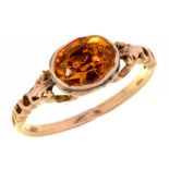 A GEORGIAN CITRINE RING, EARLY 19TH C in gold with pierced shoulders and fluted hoop, 2.6g, size