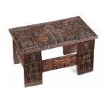 TRIBAL ART. AN AFRICAN CARVED HARDWOOD TABLE, SECOND QUARTER 20TH C 28cm h; 38 x 65cm++Good