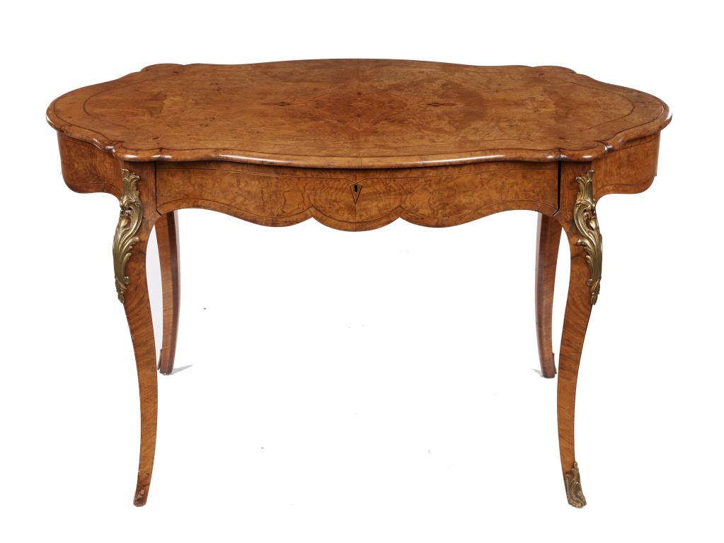 A VICTORIAN GILT BRASS MOUNTED SERPENTINE WALNUT AND INLAID CENTRE TABLE, C1860 with figured quarter