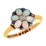 AN OPAL, DIAMOND AND SAPPHIRE CLUSTER RING, C1910 in gold marked 18ct, Su and inventory nos, 3.1g,