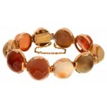 A GOLD AND HARDSTONE BRACELET with ten banded or other agate cabochons, graduated from the centre,