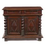 A WALNUT SIDE CABINE , EARLY 17TH C with two deeply moulded drawers above three spiral pilasters and