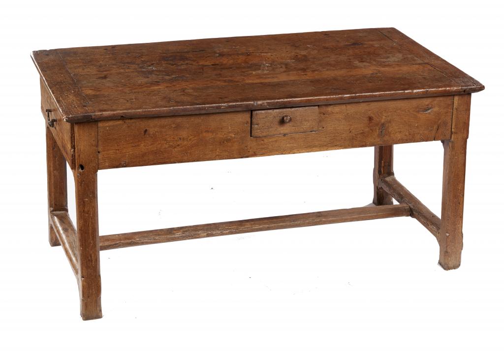 A FRENCH OAK TABLE, 19TH CENTURY the boarded top with cleated ends, on chamferred legs with