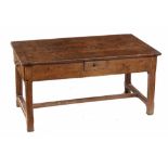 A FRENCH OAK TABLE, 19TH CENTURY the boarded top with cleated ends, on chamferred legs with