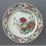 A CHINESE FAMILLE ROSE PLATE, QING DYNASTY, QIANLONG PERIOD 22cm diam++Pinhead sized flat chip on