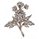 A DIAMOND FLOWER BROOCH, C LATE 19TH C with old cut diamonds, in silver and gold, 52mm, 10g++Good