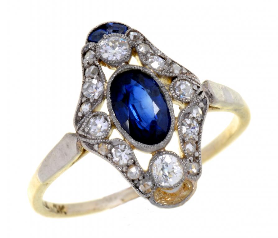 AN ART DECO SAPPHIRE AND DIAMOND RING, C1930 with larger oval central sapphire and pierced